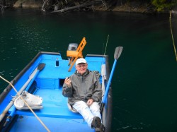 DR TOM EATING A PLUM - NOTE HIS SPECIAL CHAIR IN THE BACK GROUND
