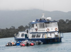 PUMA II WITH LAKE AND RIVER BOATS IN TOW