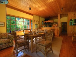 PUMA LODGE DINING AREA WITH KITCHEN IN BACKGROUND