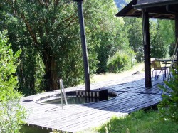 HOT TUB ON FRONT PORCH AT LODGE