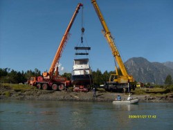 PUMA II BEING LOADED ON TRUCK AT MOUTH OF YELCHO RIVER FOR TRANSPORT TO THE LAKE