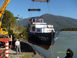 PUMA II BEING LOADED ON TRUCK AT MOUTH OF YELCHO RIVER FOR TRANSPORT TO THE LAKE