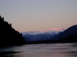 YELCHO RIVER WITH SUN SETTING ON THE MICHIMAHUIDA GLACIER