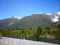 FISHING A RUN ON THE YELCHO RIVER WITH THE HANGING GLACIER IN THE BACKGROUND
