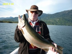 TROPHY RAINBOW - LAKE YELCHO -- CAUGHT IN FEB. 2010 NOT THE DATE ON THE PHOTO (WHEN PHOTO WAS SENT TO ME) --LESSON NEEDED IN HOW TO HOLD FISH FOR PHOTO (GUIDE HAS BEEN TALKED TO).