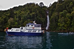 PUMA II WITH SKIFFS AT A WATERFALL