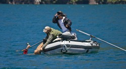 SWIMS WITH RAINBOWS (CAPTAIN BILL CURTIS)-BILL STILL HAS ROD AND PABLO IS GETTING READY TO GO IN